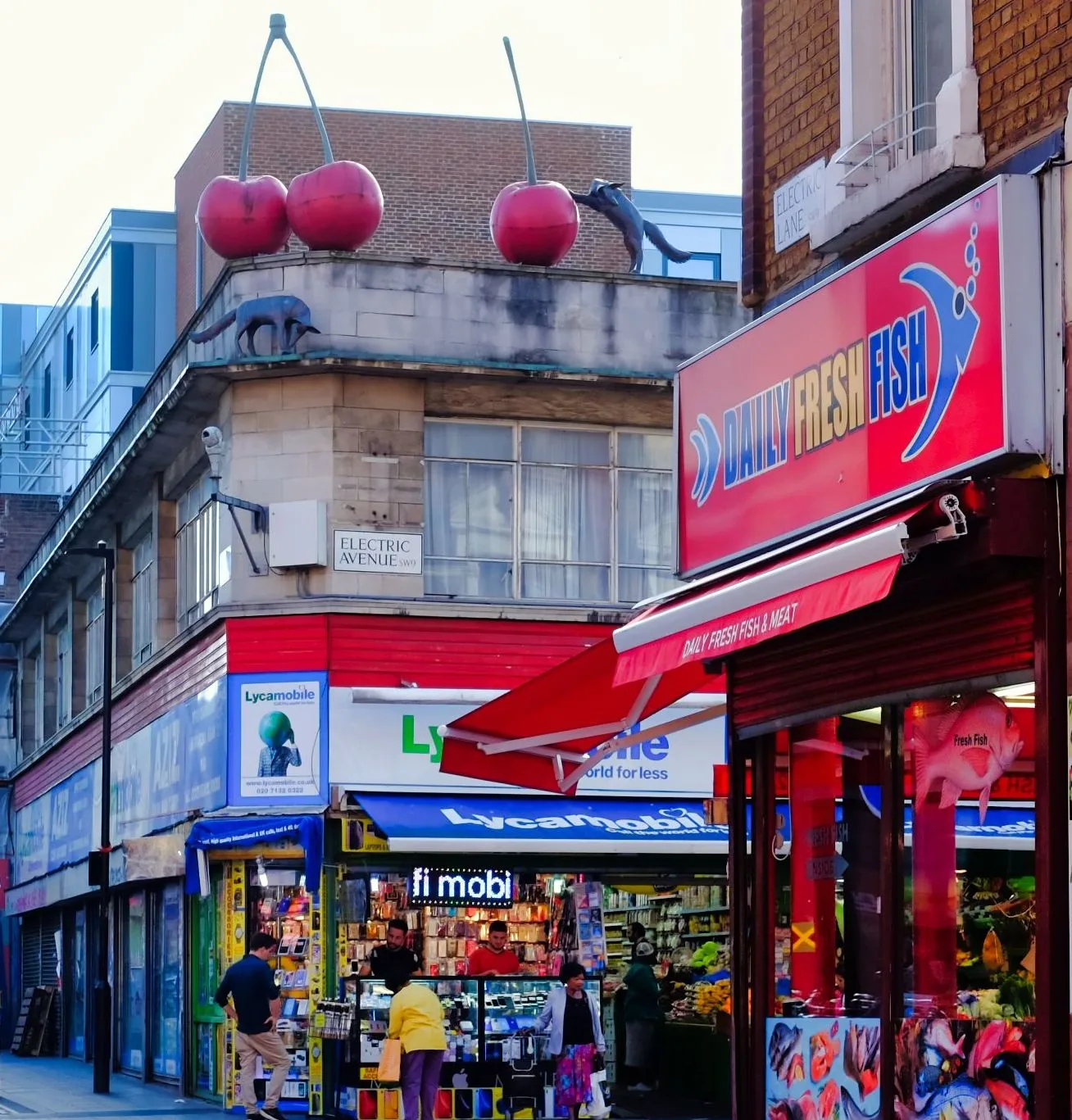 The Electric Avenue street sign and shopfronts in Brixton.